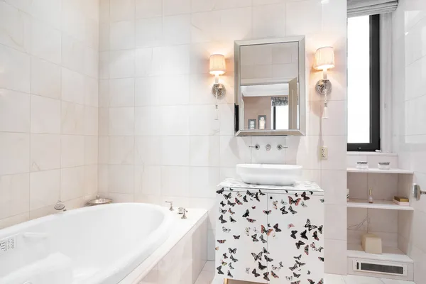 a bathroom with a bathtub and a sink