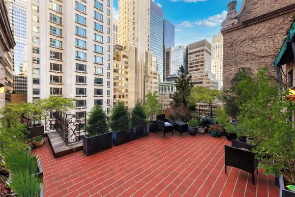 a view of a terrace with sitting area