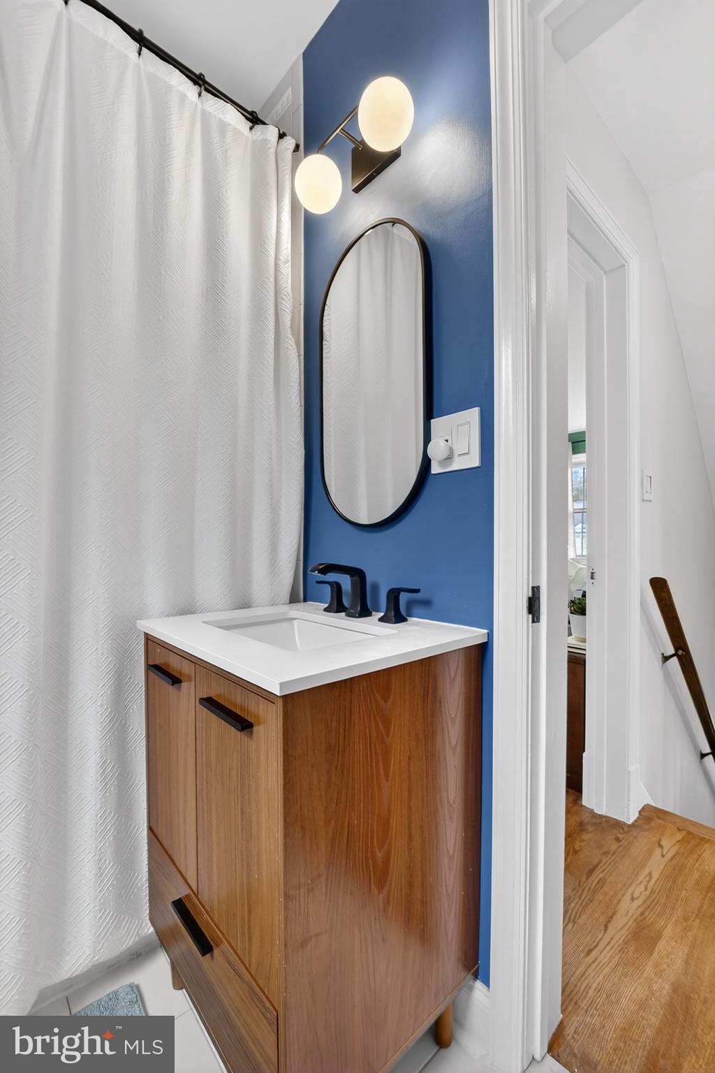 5445 30th Street Northwest Washington, DC 20015 - Photo 29 of 46 a bathroom with a sink and a mirror