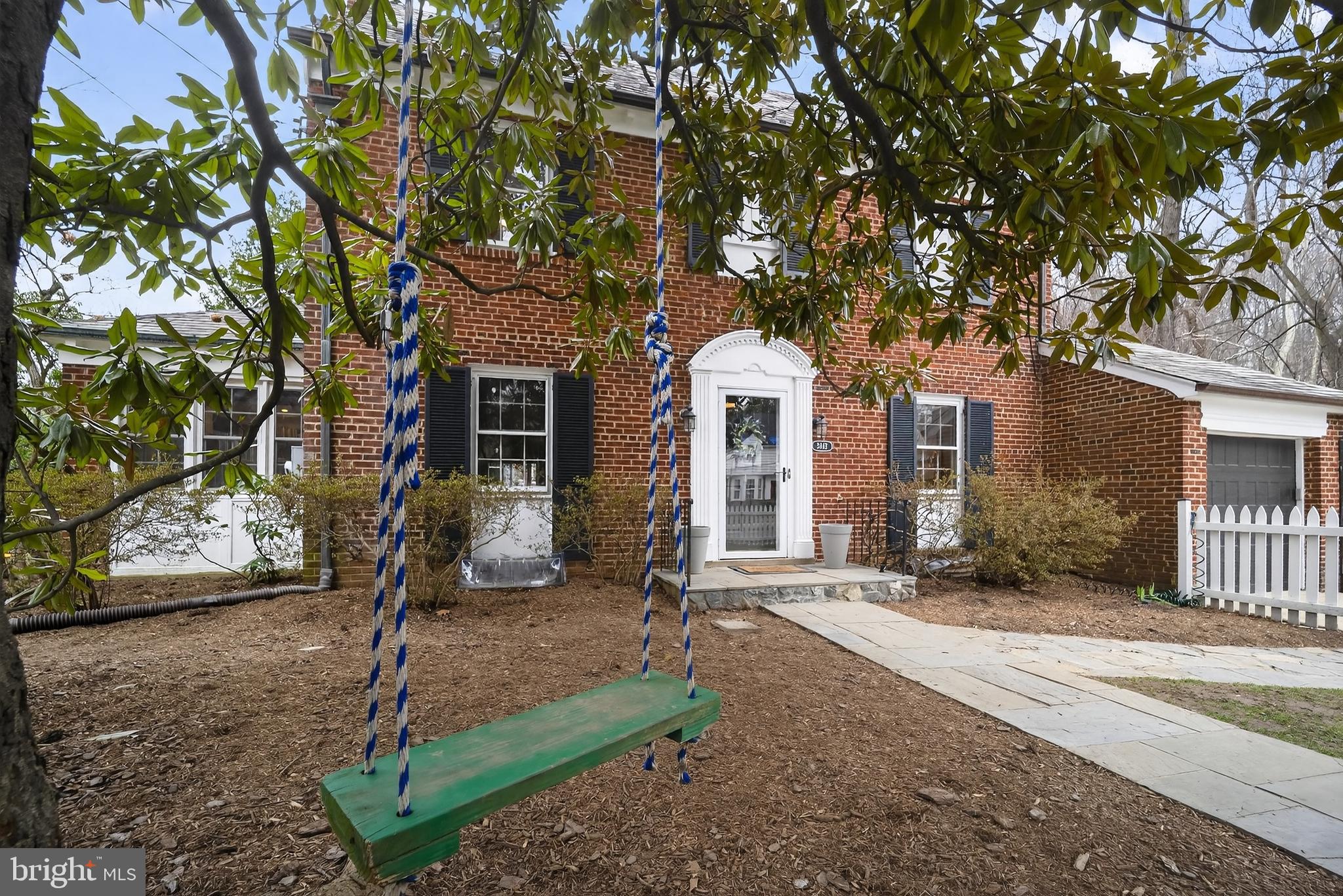 5445 30th Street Northwest Washington, DC 20015 - Photo 3 of 46 a front view of a house with a tree