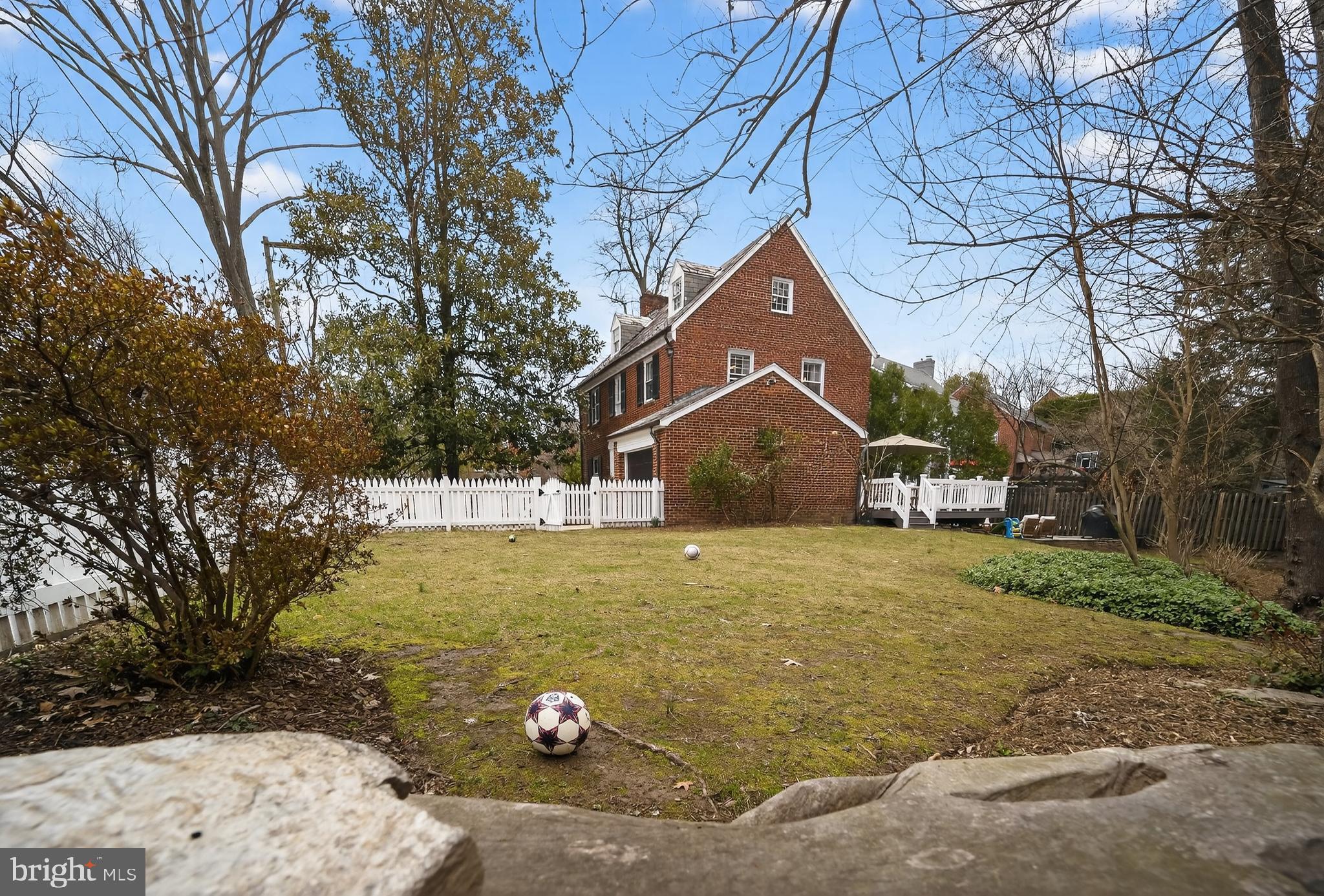 5445 30th Street Northwest Washington, DC 20015 - Photo 4 of 46 a front view of a house with a yard