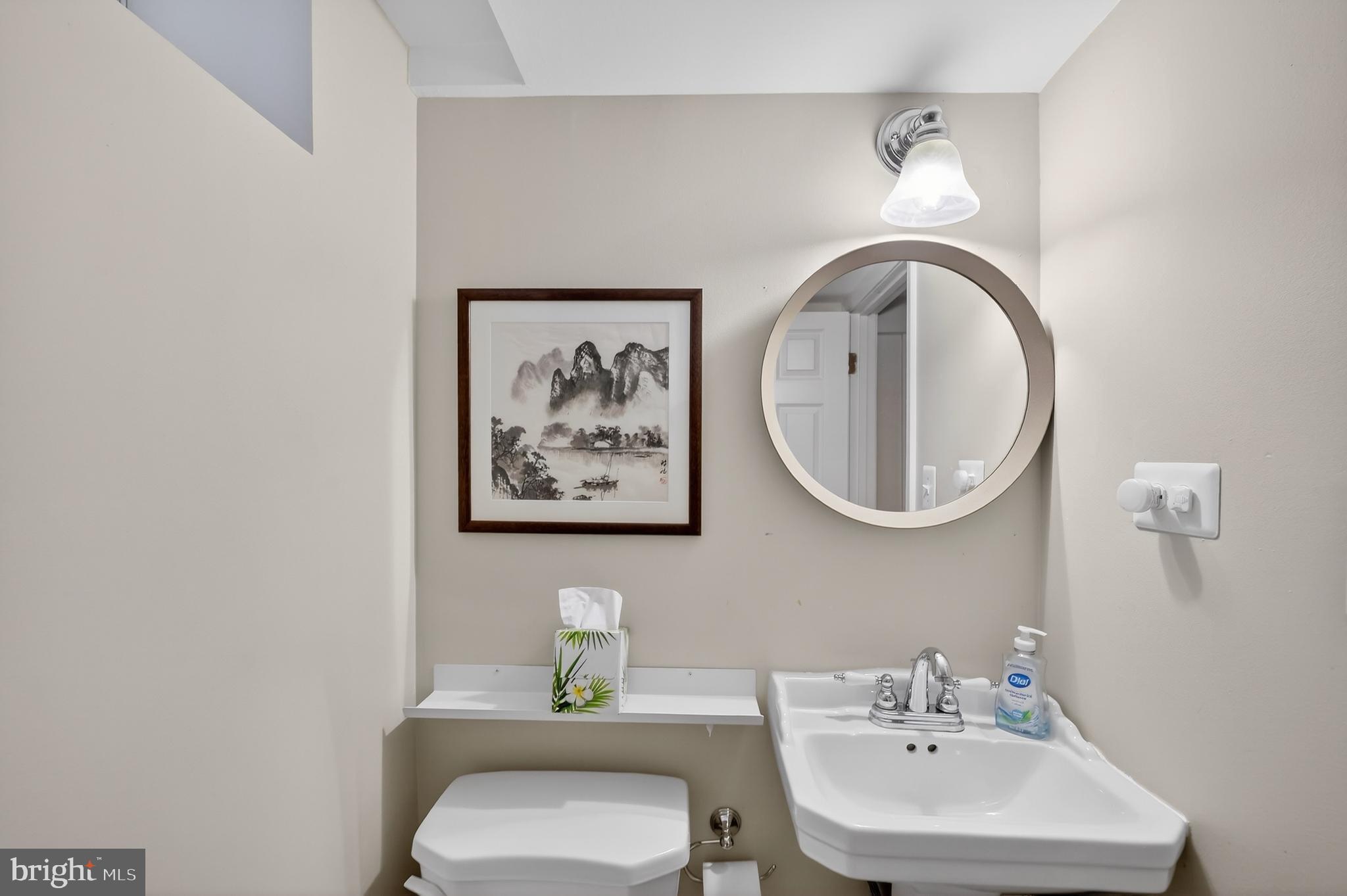 5445 30th Street Northwest Washington, DC 20015 - Photo 42 of 46 a bathroom with a toilet and a sink