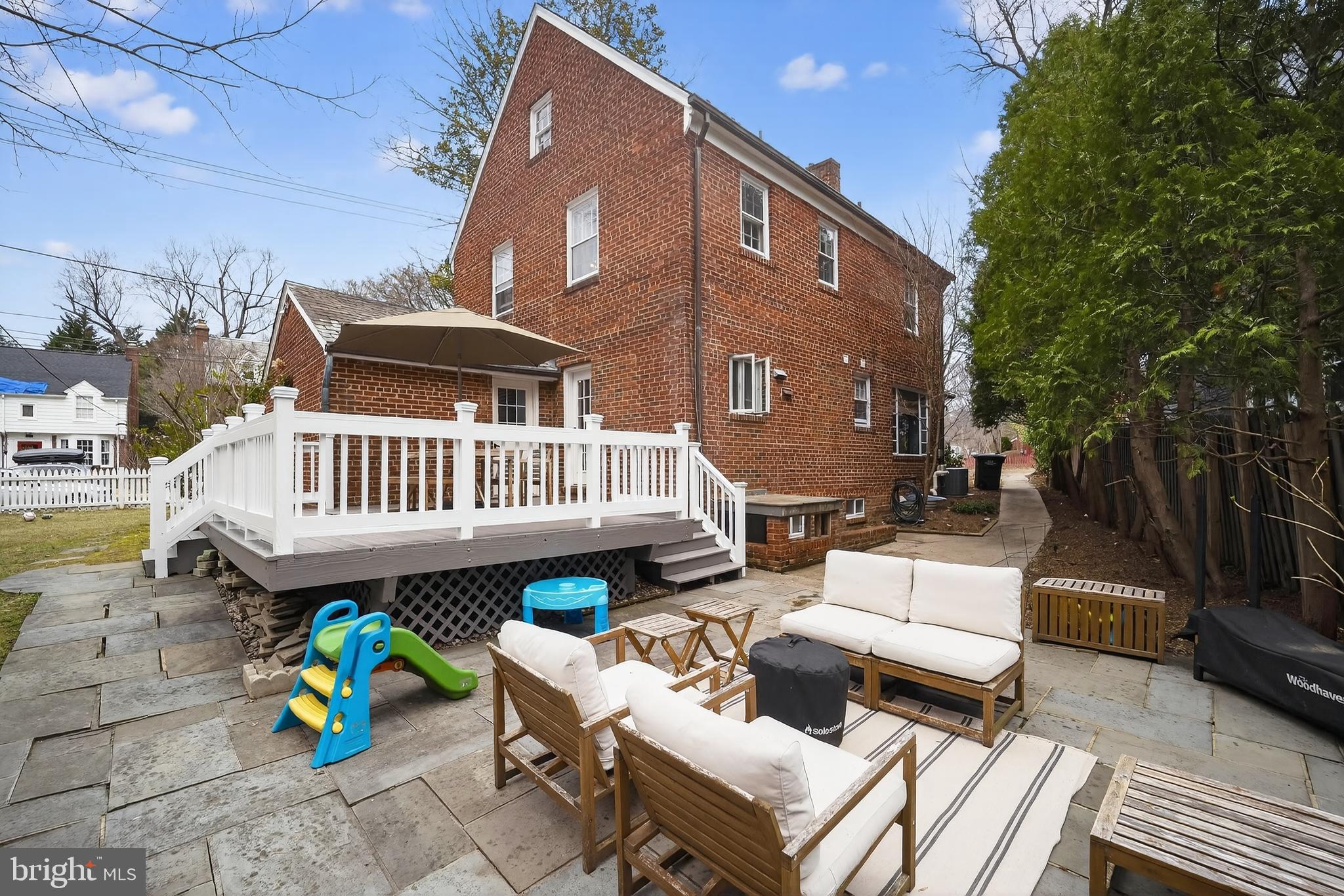 5445 30th Street Northwest Washington, DC 20015 - Photo 44 of 46 a view of a patio with couches table and chairs and potted plants