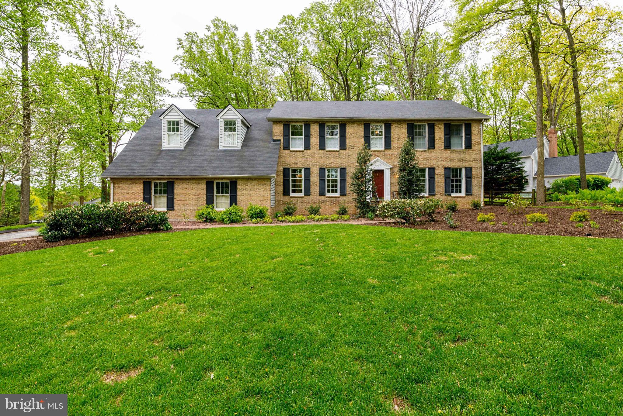 1007 Valewood Road Towson, MD 21286 - Photo 1 of 49 a front view of a house with a garden and trees