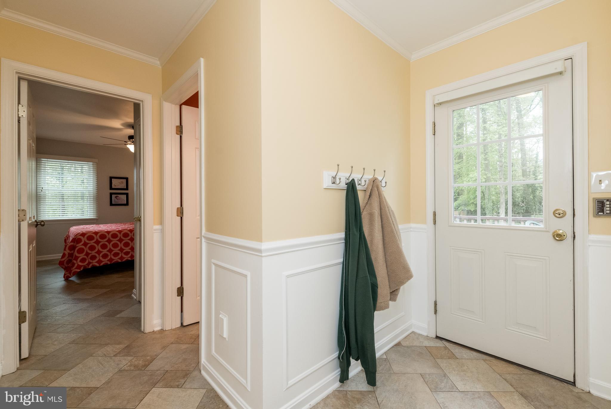 1007 Valewood Road Towson, MD 21286 - Photo 17 of 49 a view of a bedroom with a bed and wooden floor