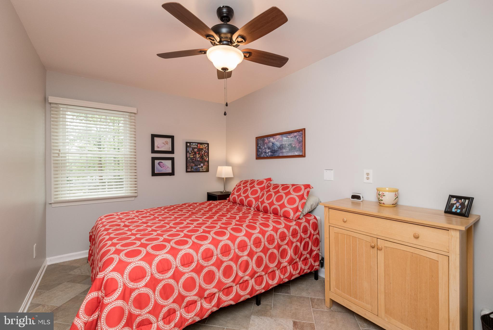 1007 Valewood Road Towson, MD 21286 - Photo 18 of 49 a bedroom with a large bed and a chandelier