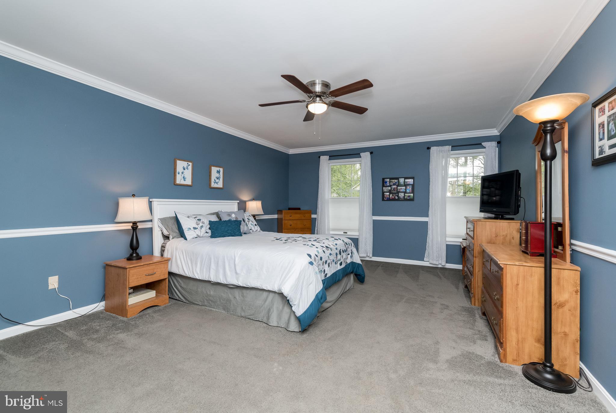1007 Valewood Road Towson, MD 21286 - Photo 21 of 49 a bed room with a bed and a television