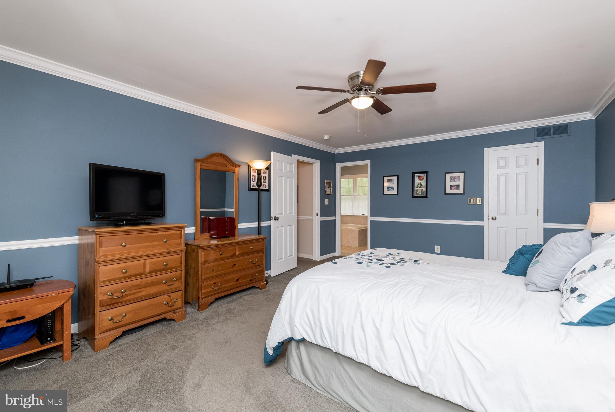 1007 Valewood Road Towson, MD 21286 - Photo 22 of 49 a bedroom with a bed and a flat screen tv