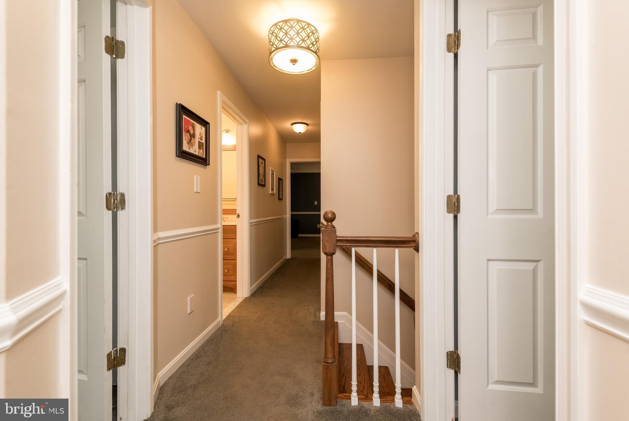 1007 Valewood Road Towson, MD 21286 - Photo 29 of 49 a view of hallway with wooden floor and staircase