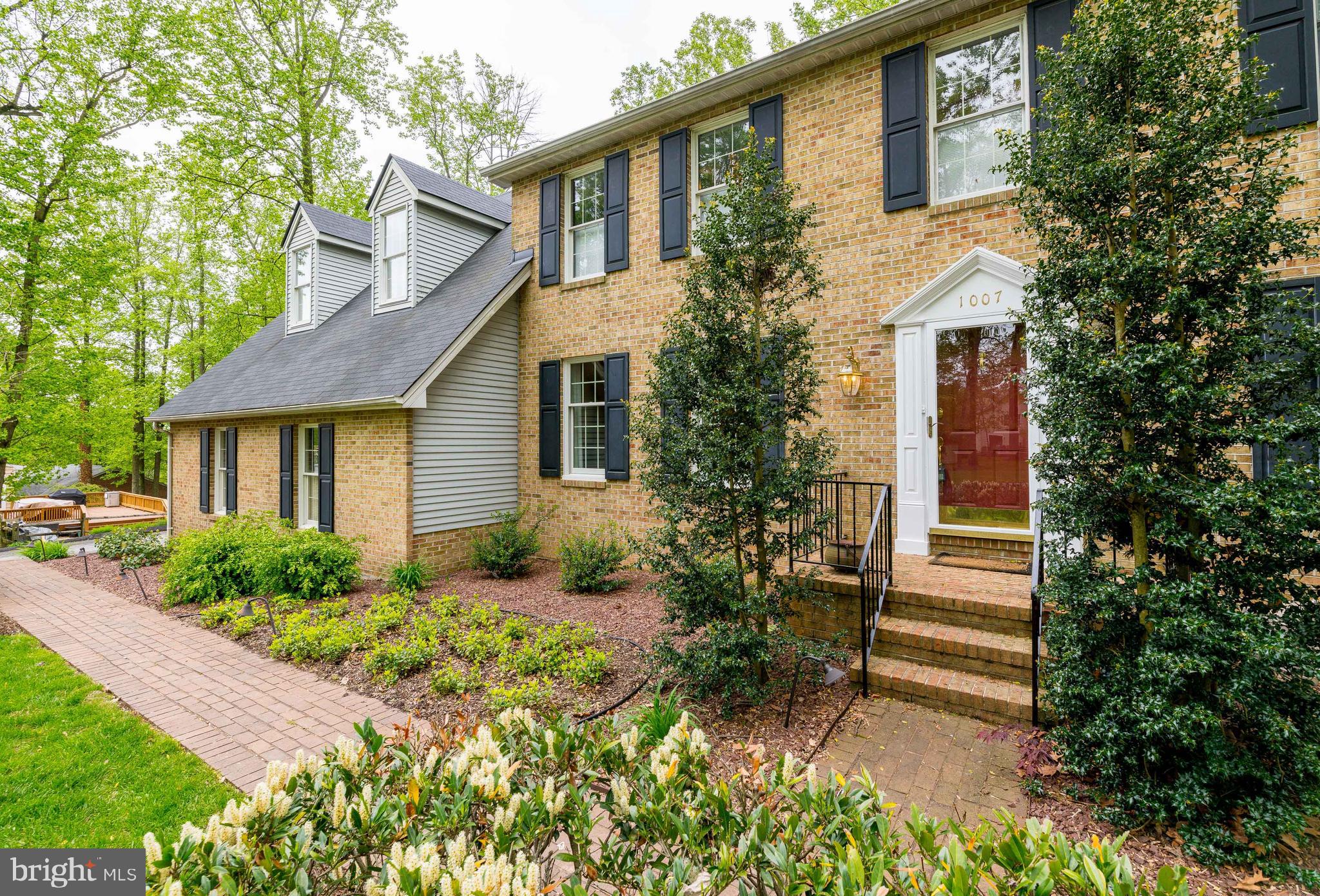1007 Valewood Road Towson, MD 21286 - Photo 4 of 49 a front view of a house with a garden