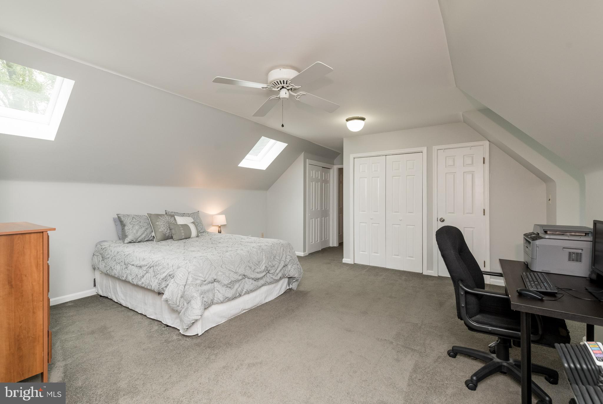 1007 Valewood Road Towson, MD 21286 - Photo 36 of 49 a spacious bedroom with a bed a desk and chair