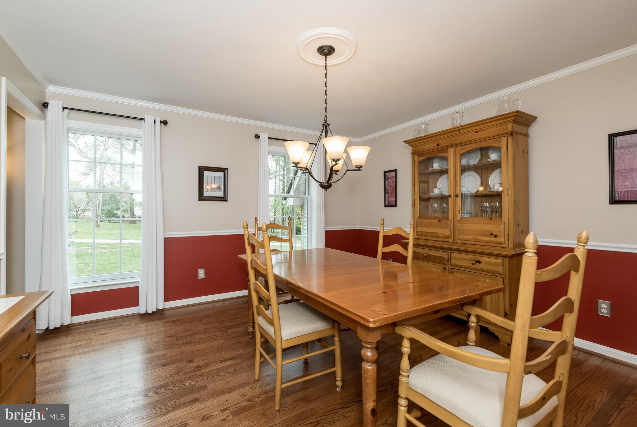 1007 Valewood Road Towson, MD 21286 - Photo 9 of 49 a dining room with furniture a chandelier and wooden floor