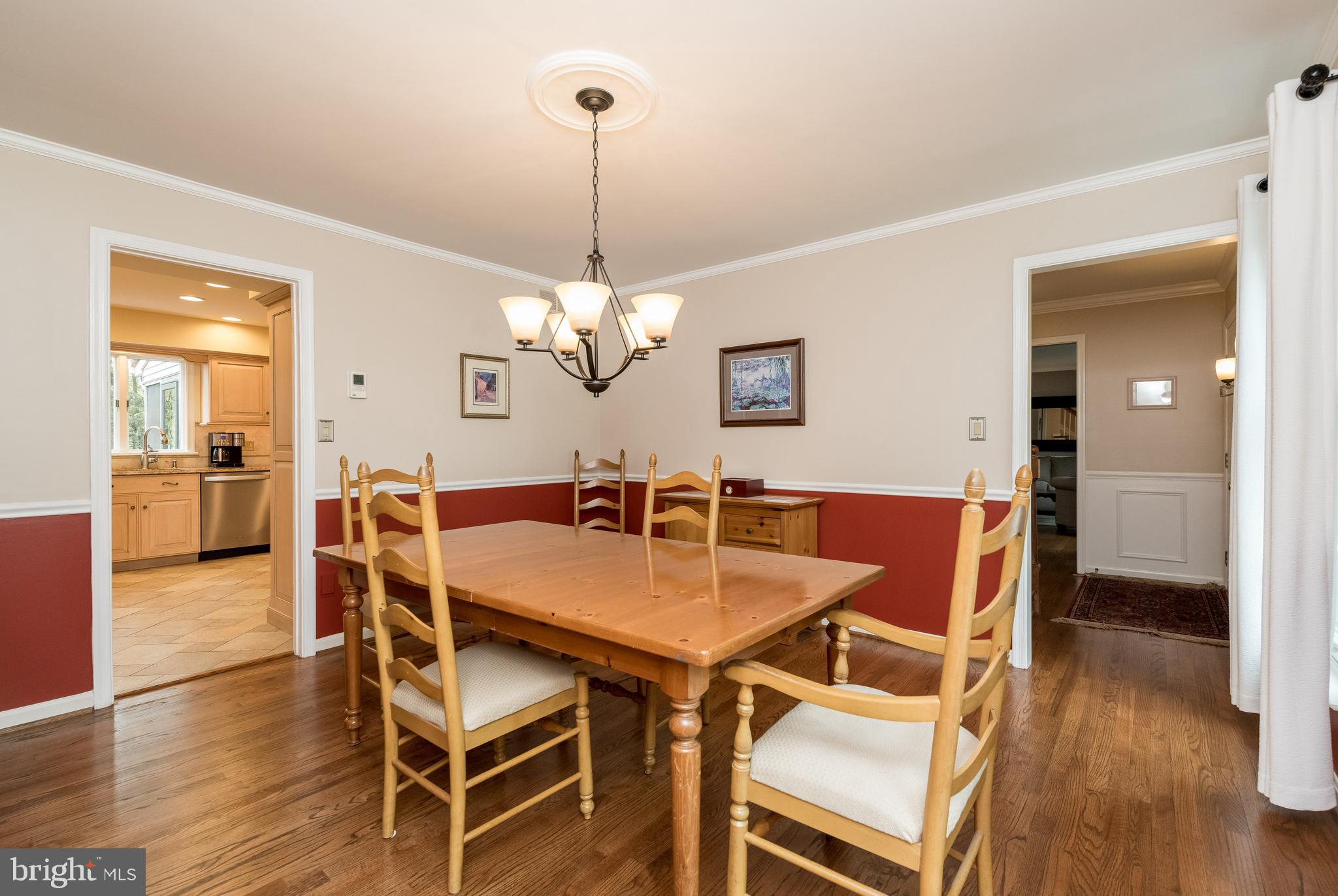 1007 Valewood Road Towson, MD 21286 - Photo 10 of 49 a view of a dining room with furniture wooden floor and chandelier