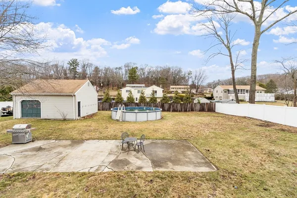 a view of a house with a backyard