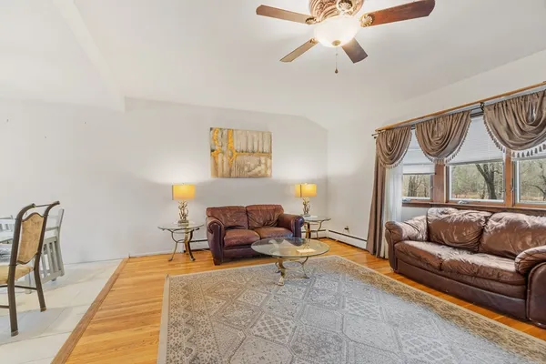 a living room with furniture and a rug