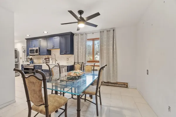 a dining room with furniture and window
