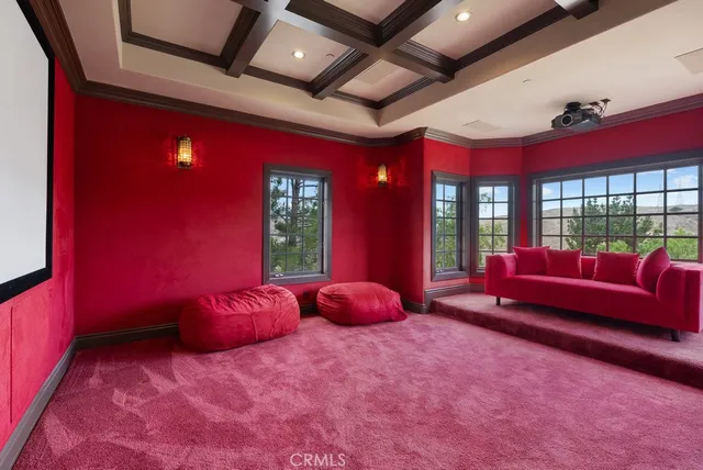 a bedroom with furniture and a large window