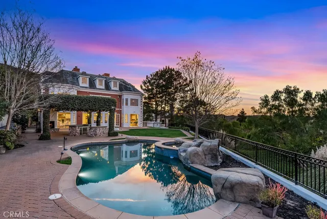 a view of a swimming pool with a patio