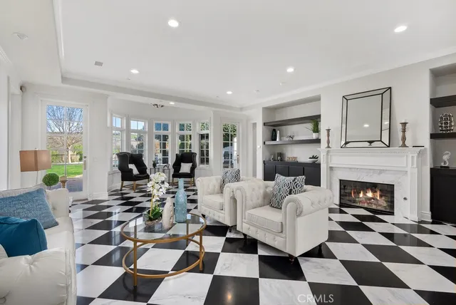 a living room with furniture a rug and a fireplace