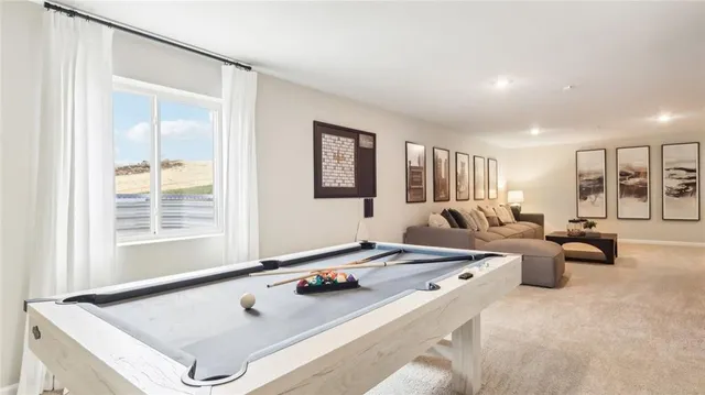 a living room with furniture and window