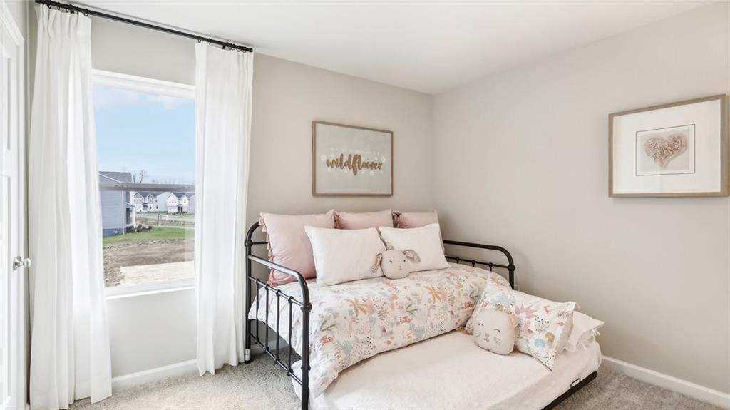 207 Joseph Drive Hunker, PA 15639 - Photo 10 of 25 a bed room with a bed and a window