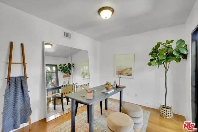 a bathroom with a sink a light fixture and a mirror