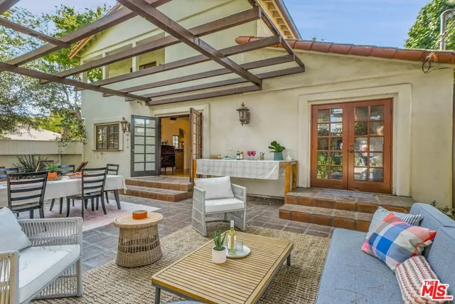a view of a balcony with next to a yard