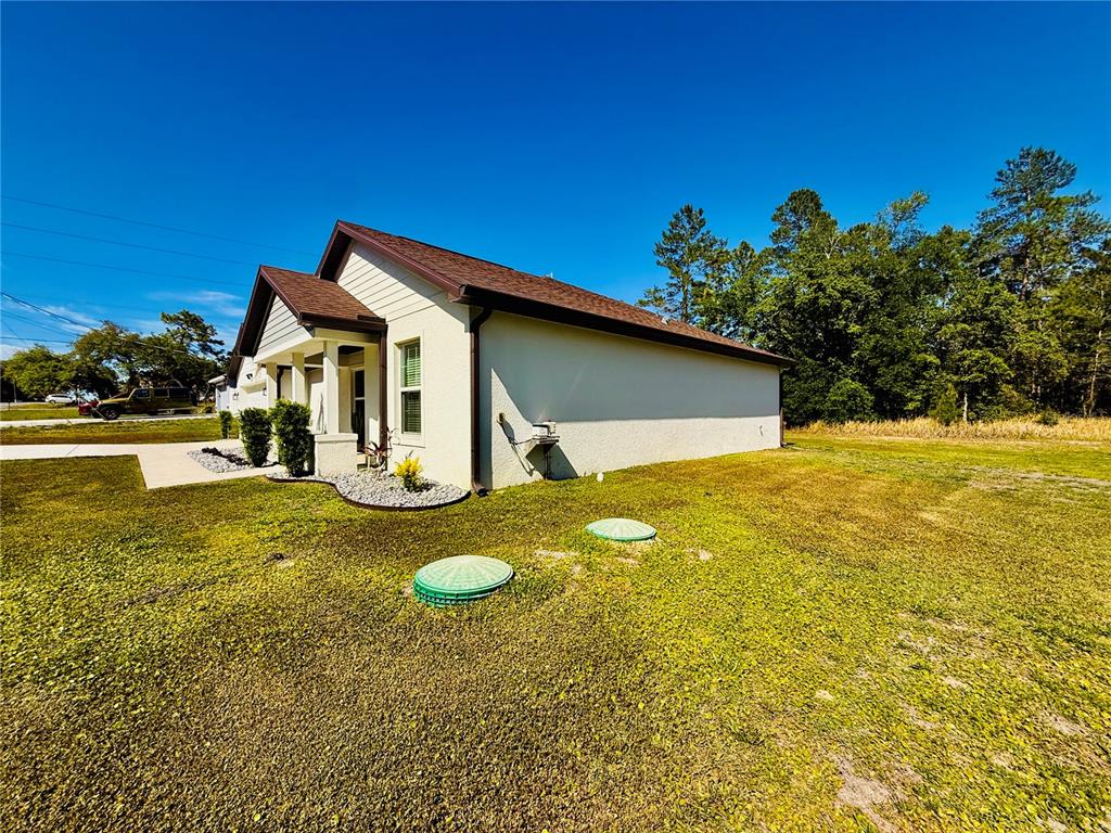 13486 English Sparrow Road Weeki Wachee, FL 34614 - Photo 41 of 51 a view of a house with a yard