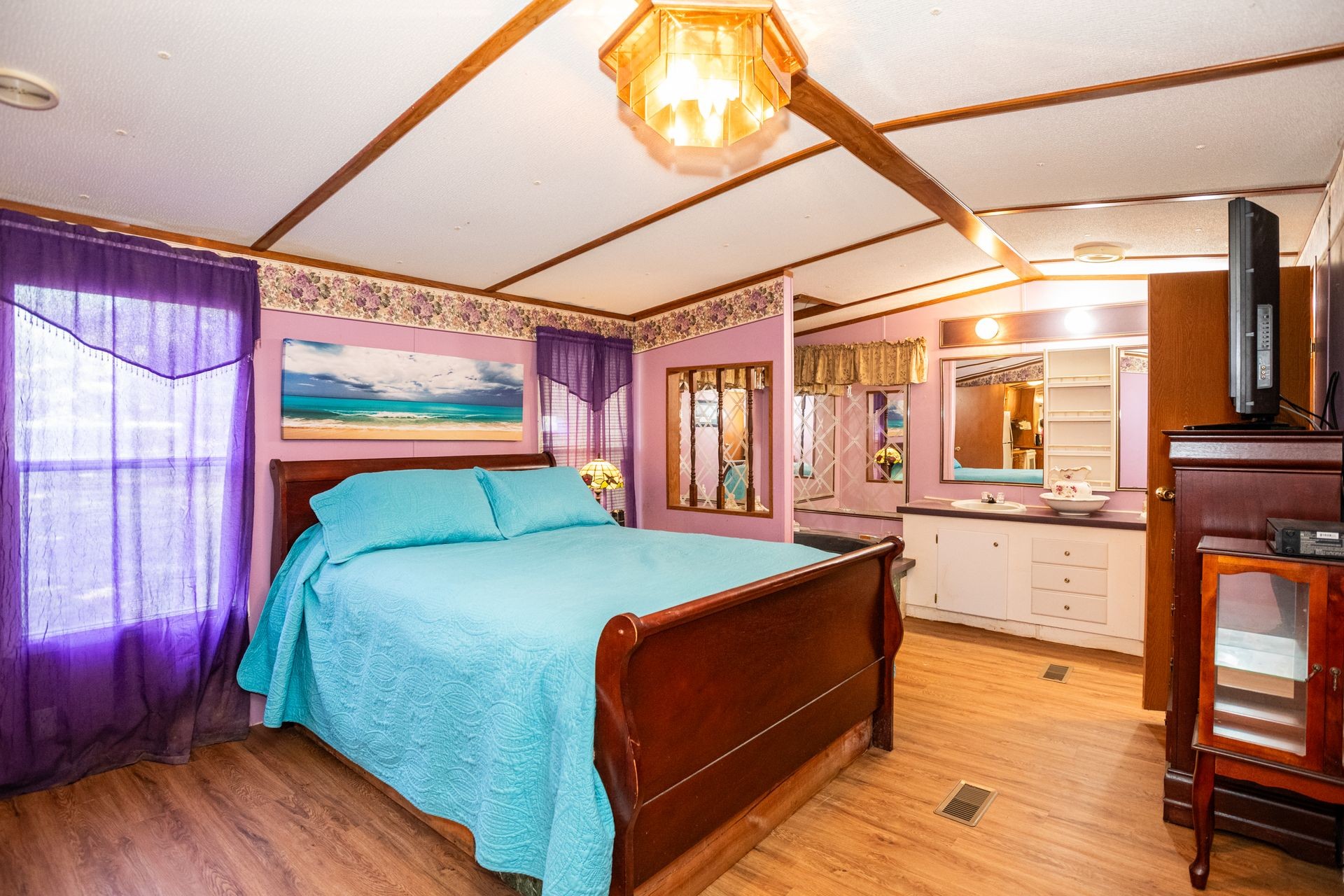 1810 Jim Kim Road Cunningham, TN 37052 - Photo 4 of 37 a bedroom with a bed and wooden floor