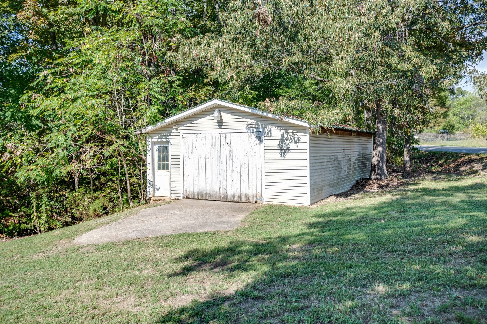 1810 Jim Kim Road Cunningham, TN 37052 - Photo 5 of 37 a front view of a house with garden