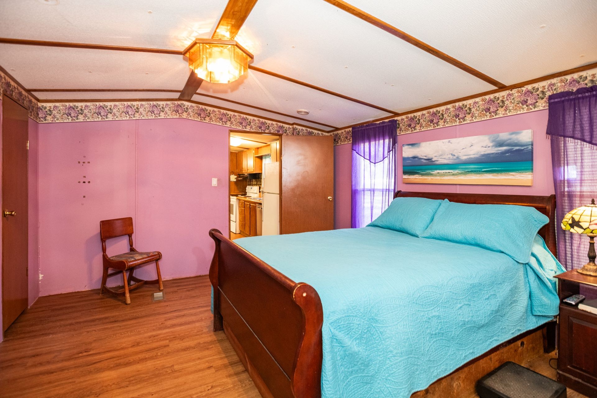 1810 Jim Kim Road Cunningham, TN 37052 - Photo 6 of 37 a bed room with a bed and a chandelier