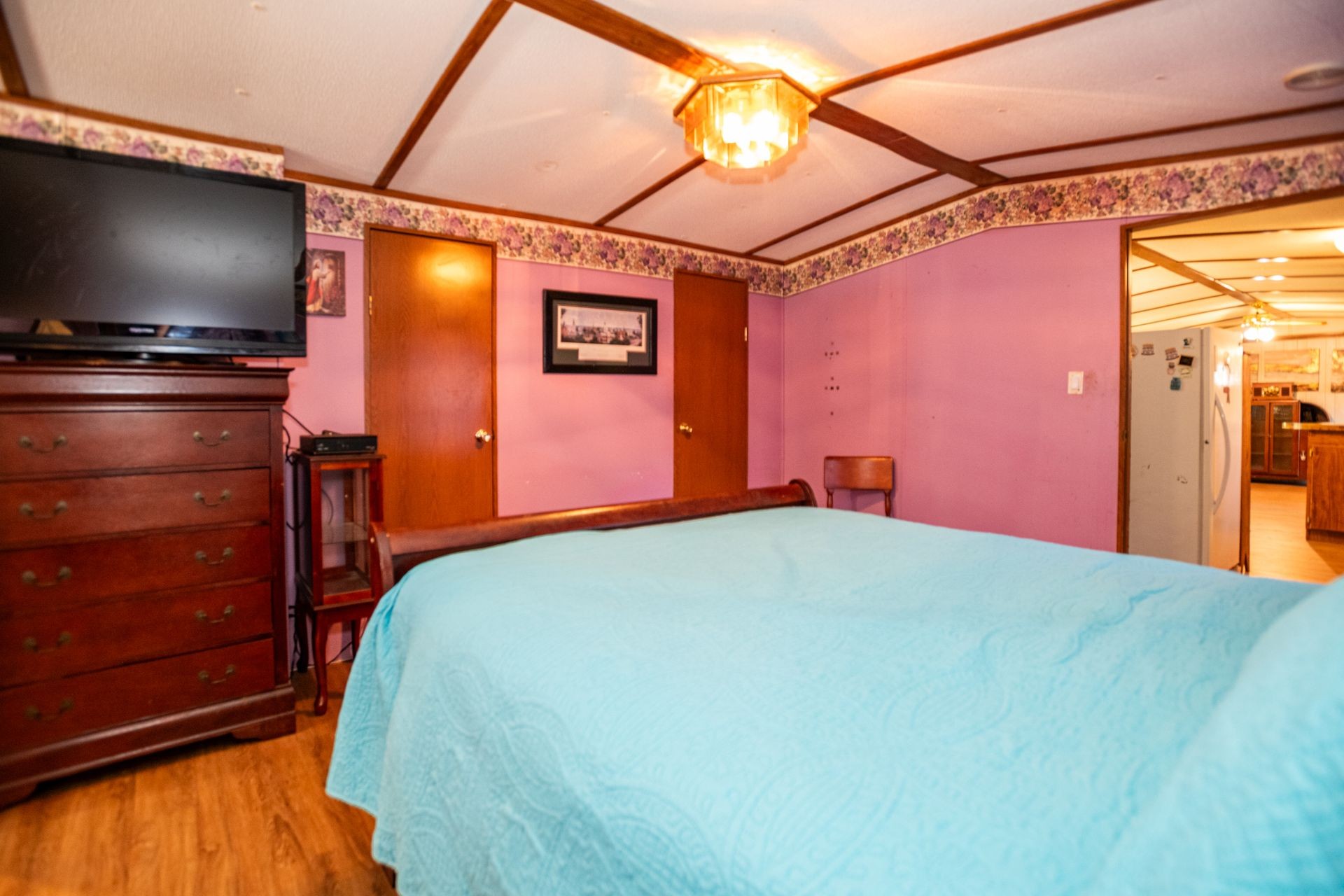 1810 Jim Kim Road Cunningham, TN 37052 - Photo 9 of 37 a bed room with a bed and a flat screen tv