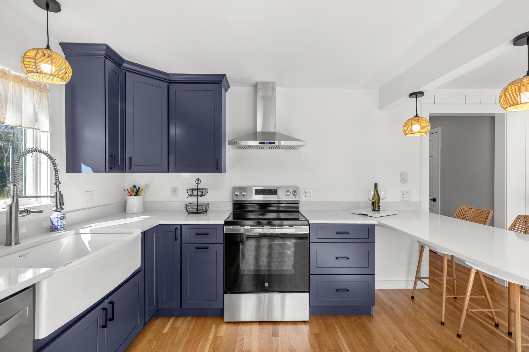 1295 Massasoit Road Eastham, MA 02642 - Photo 16 of 32 a kitchen with a stove and a sink