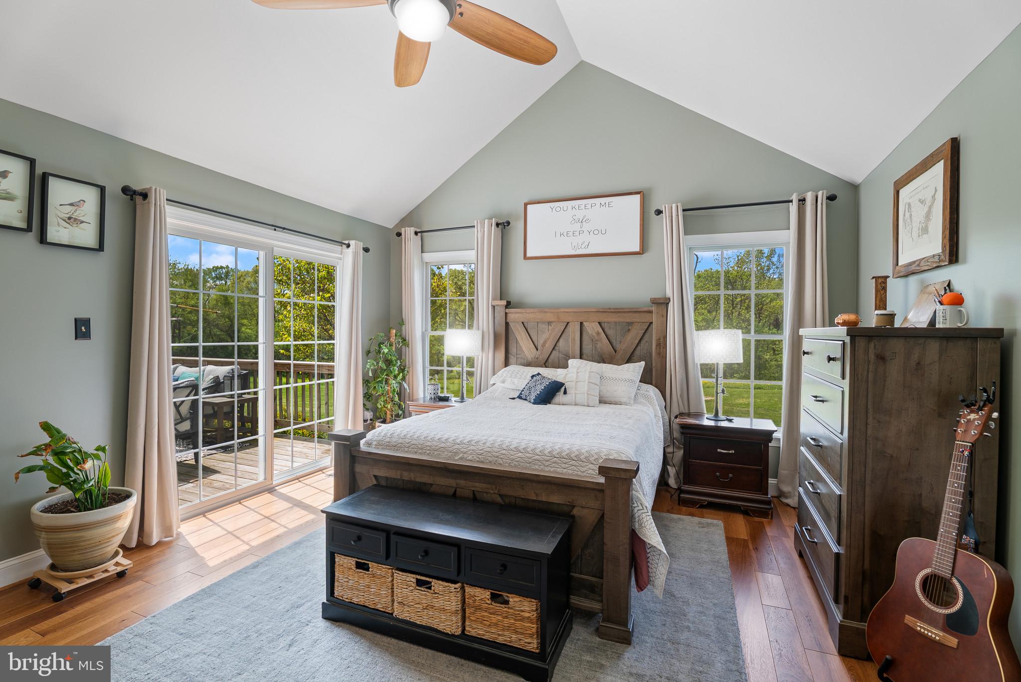 418 North Clear Ridge Road Union Bridge, MD 21791 - Photo 21 of 49 a bedroom with a bed a large window and wooden floor