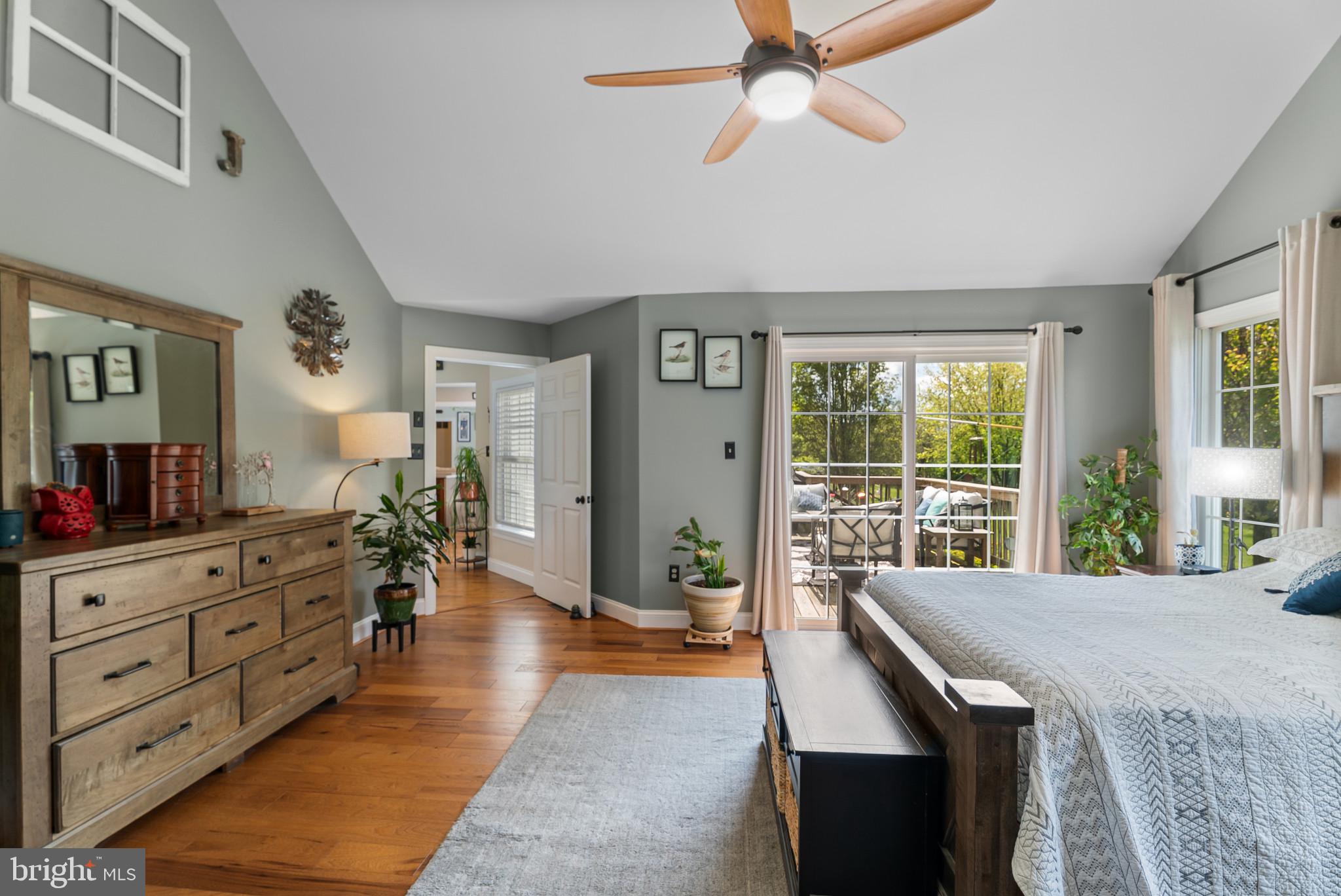 418 North Clear Ridge Road Union Bridge, MD 21791 - Photo 23 of 49 a spacious bedroom with a large bed and a chandelier