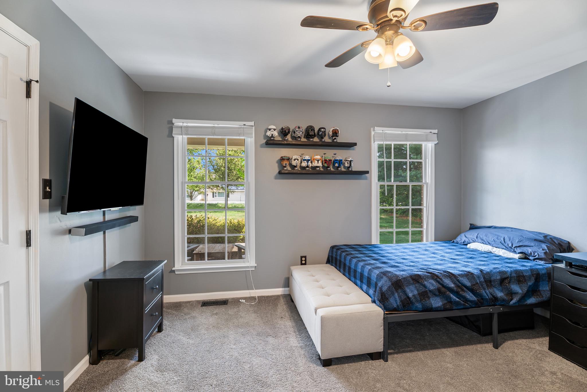 418 North Clear Ridge Road Union Bridge, MD 21791 - Photo 25 of 49 a bedroom with a bed and a flat screen tv