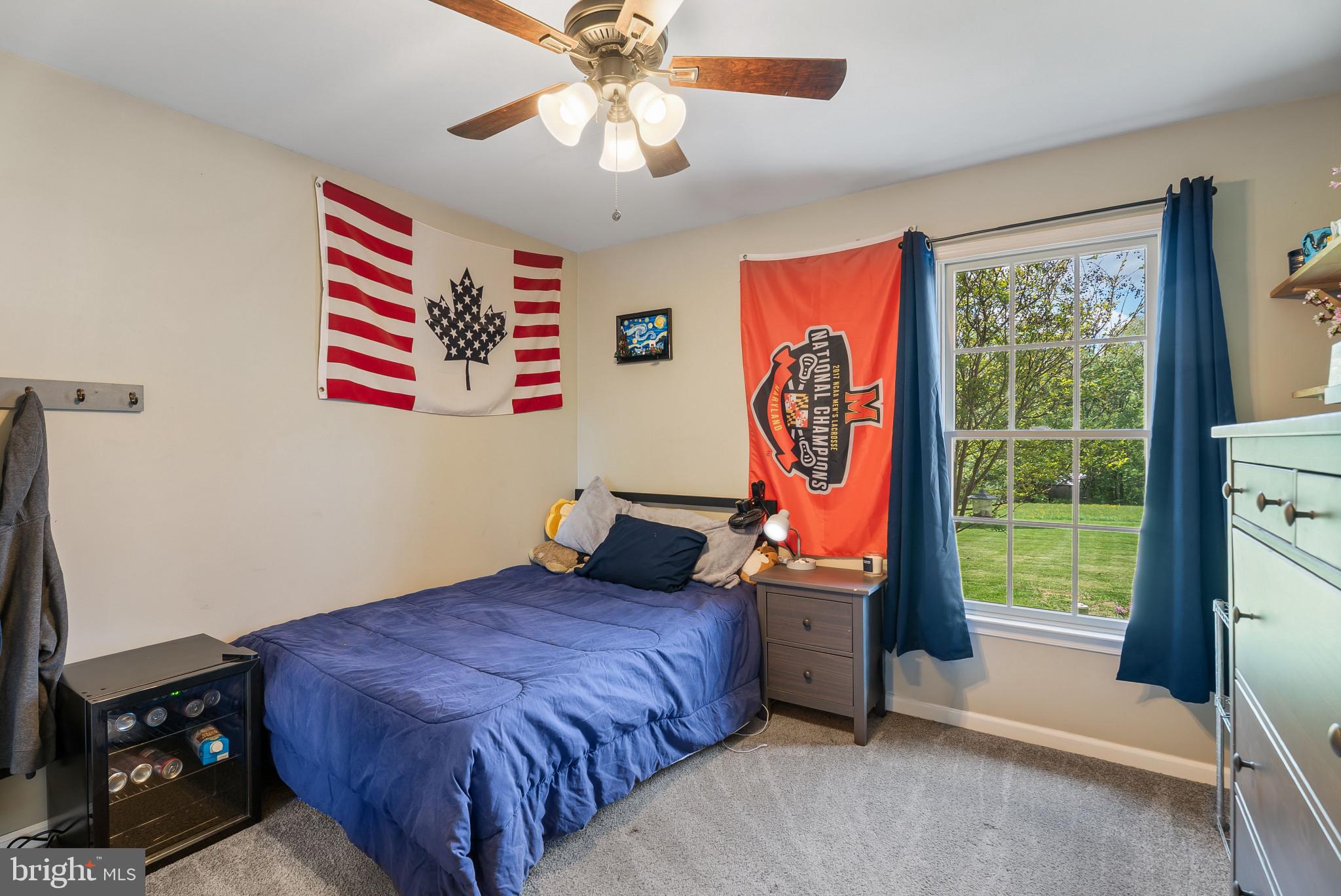 418 North Clear Ridge Road Union Bridge, MD 21791 - Photo 26 of 49 a bedroom with a bed and a window