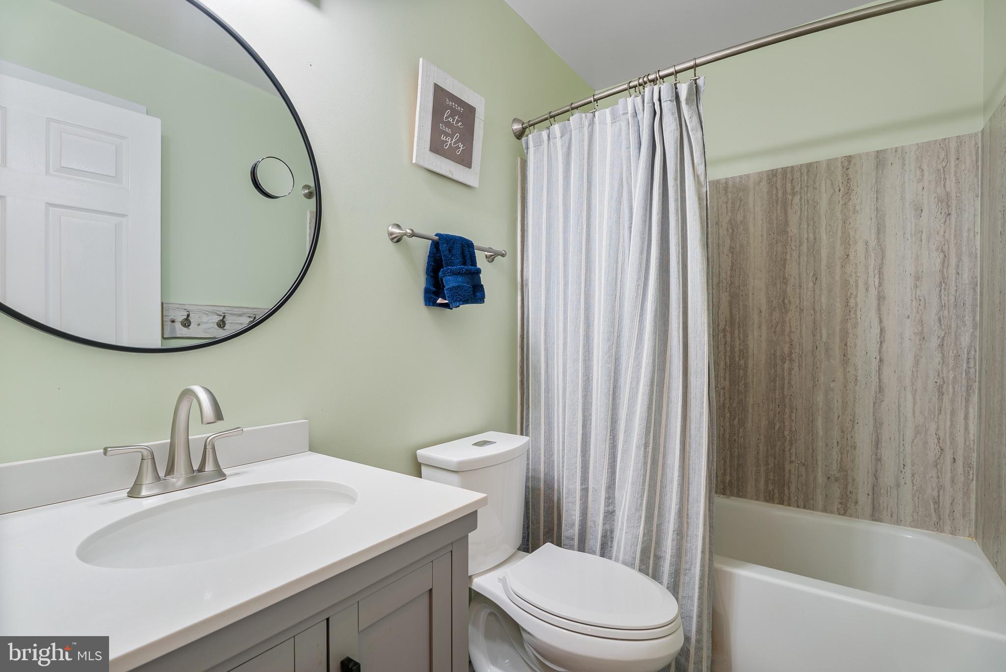 418 North Clear Ridge Road Union Bridge, MD 21791 - Photo 30 of 49 a bathroom with a toilet a sink and a mirror