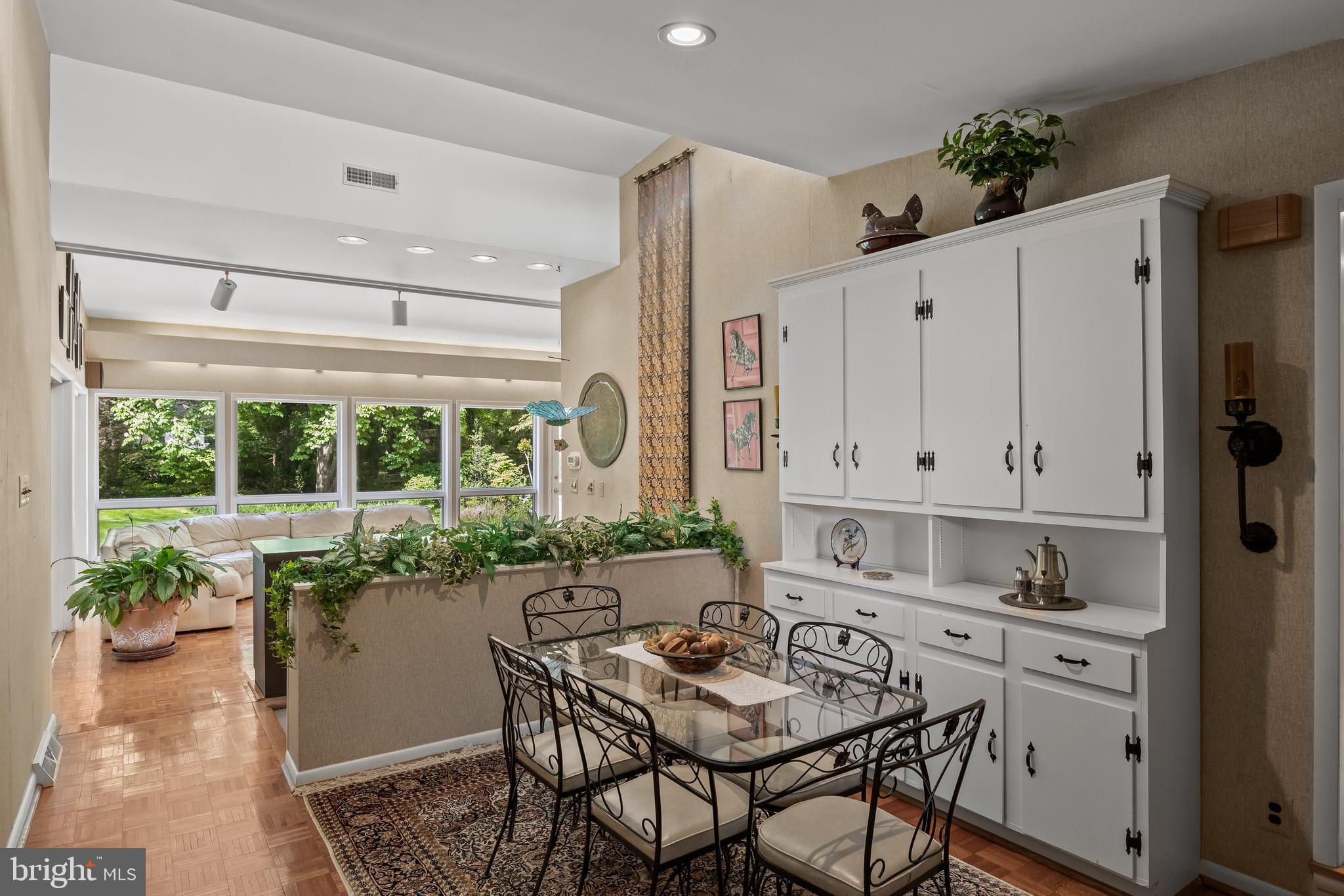 614 Chestnut Street Moorestown, NJ 08057 - Photo 24 of 86 a kitchen with stainless steel appliances kitchen island granite countertop a table and chairs in it