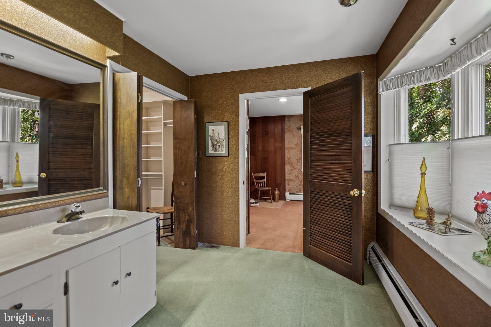 614 Chestnut Street Moorestown, NJ 08057 - Photo 37 of 86 a bathroom with a granite countertop sink and a mirror