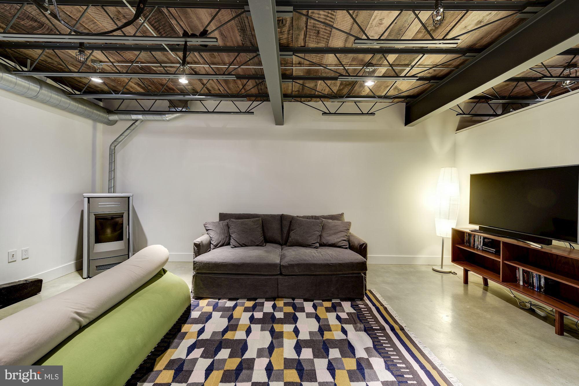 6 Thorne Road Cabin John, MD 20818 - Photo 28 of 39 Lower level with wood brning stove