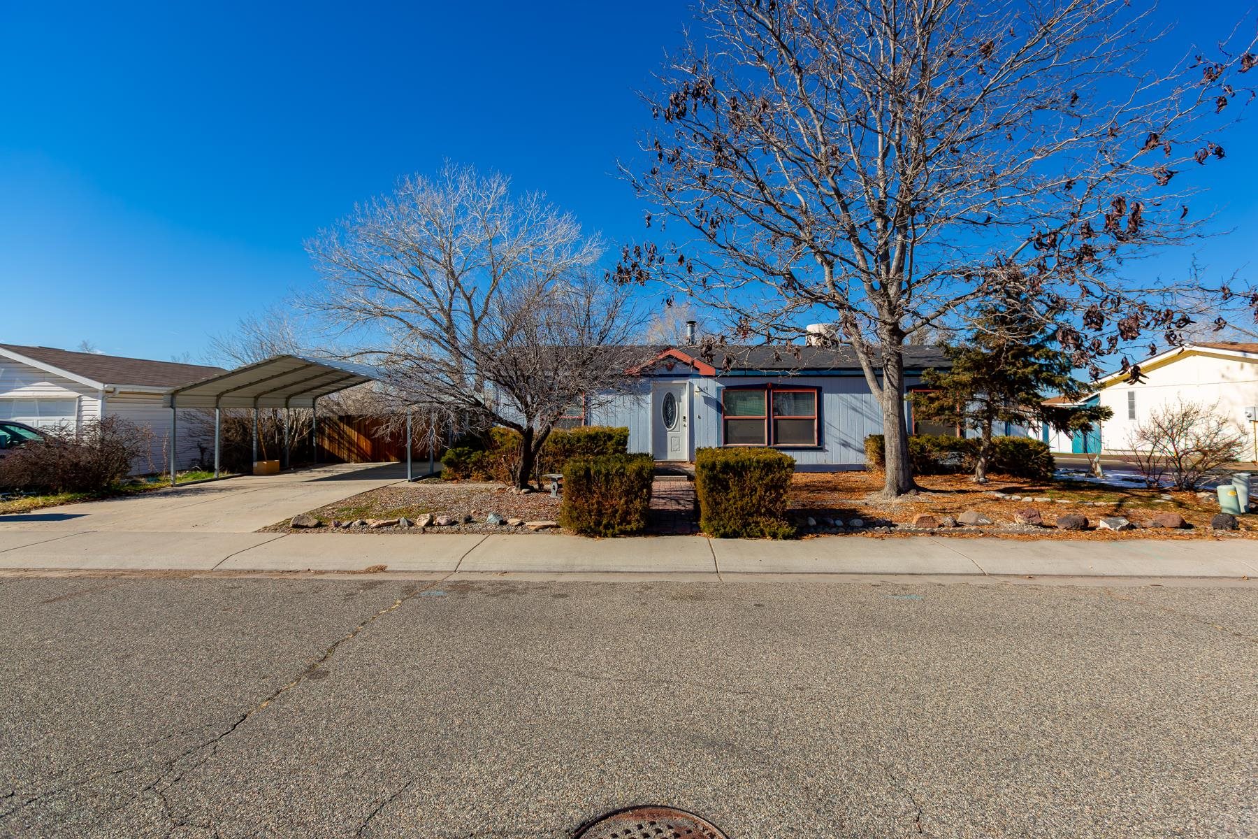 a view of a house with a yard and garage