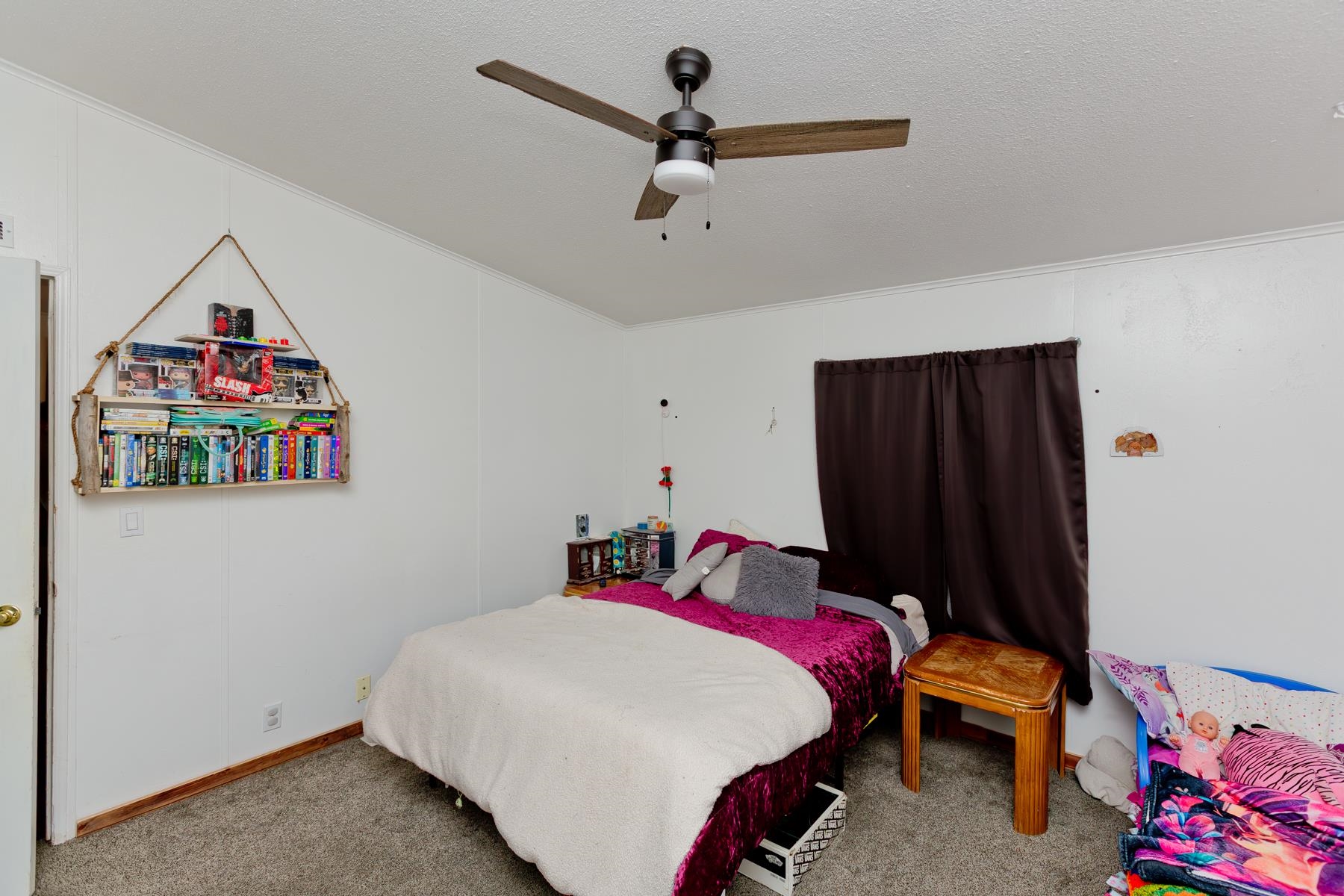 443 Florence Road Grand Junction, CO 81504 - Photo 19 of 40 a bed room with a bed and a baby bed