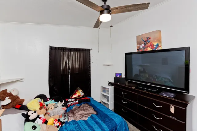 a room with furniture and flat screen tv