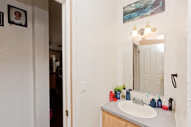 a bathroom with a sink and a mirror