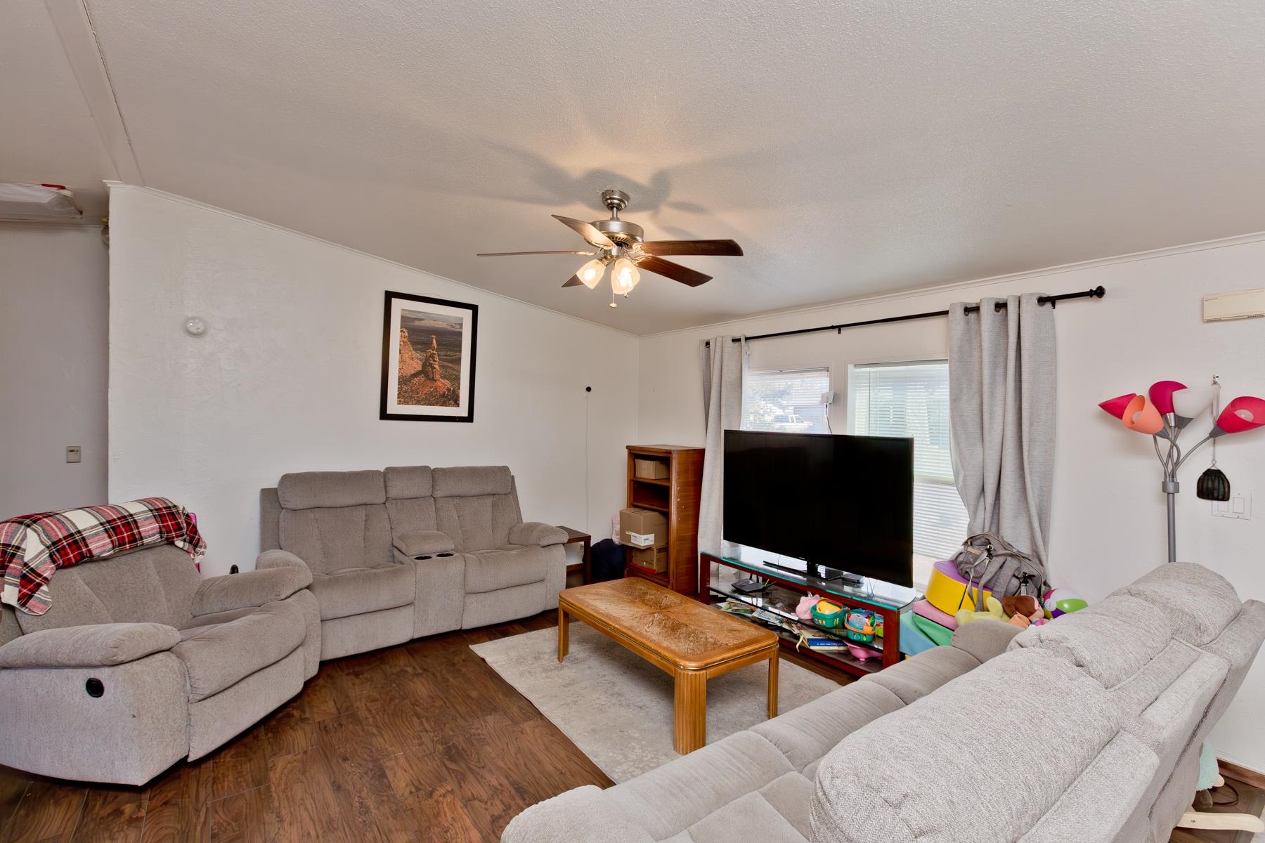 443 Florence Road Grand Junction, CO 81504 - Photo 5 of 40 a living room with furniture and a flat screen tv