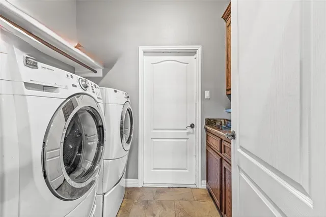 a view of a storage & utility room with washer and dryer
