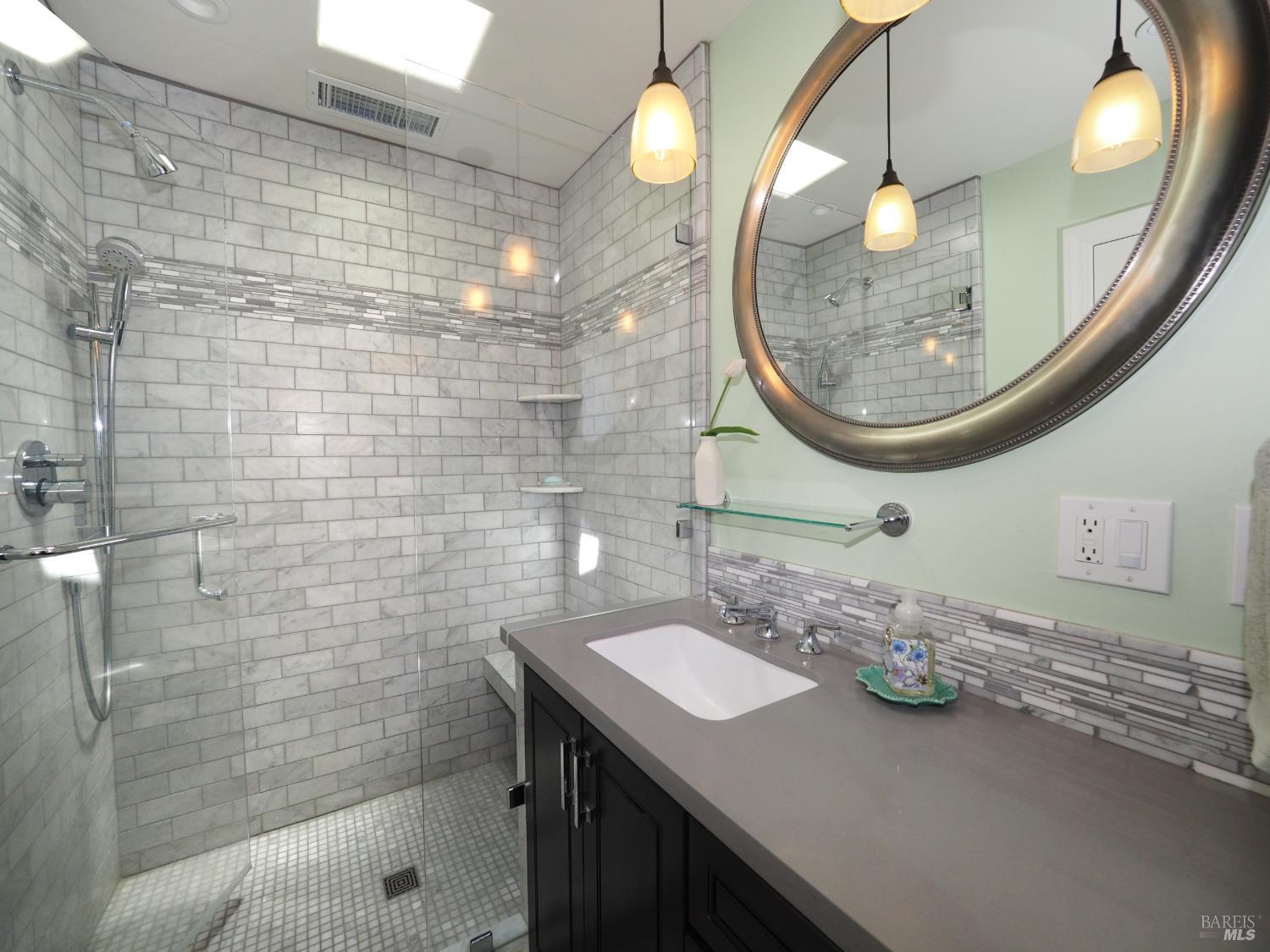 22549 River Road Geyserville, CA 95441 - Photo 34 of 63 Guests Bathroom, all tile with automatic lights when you walk in and turn off