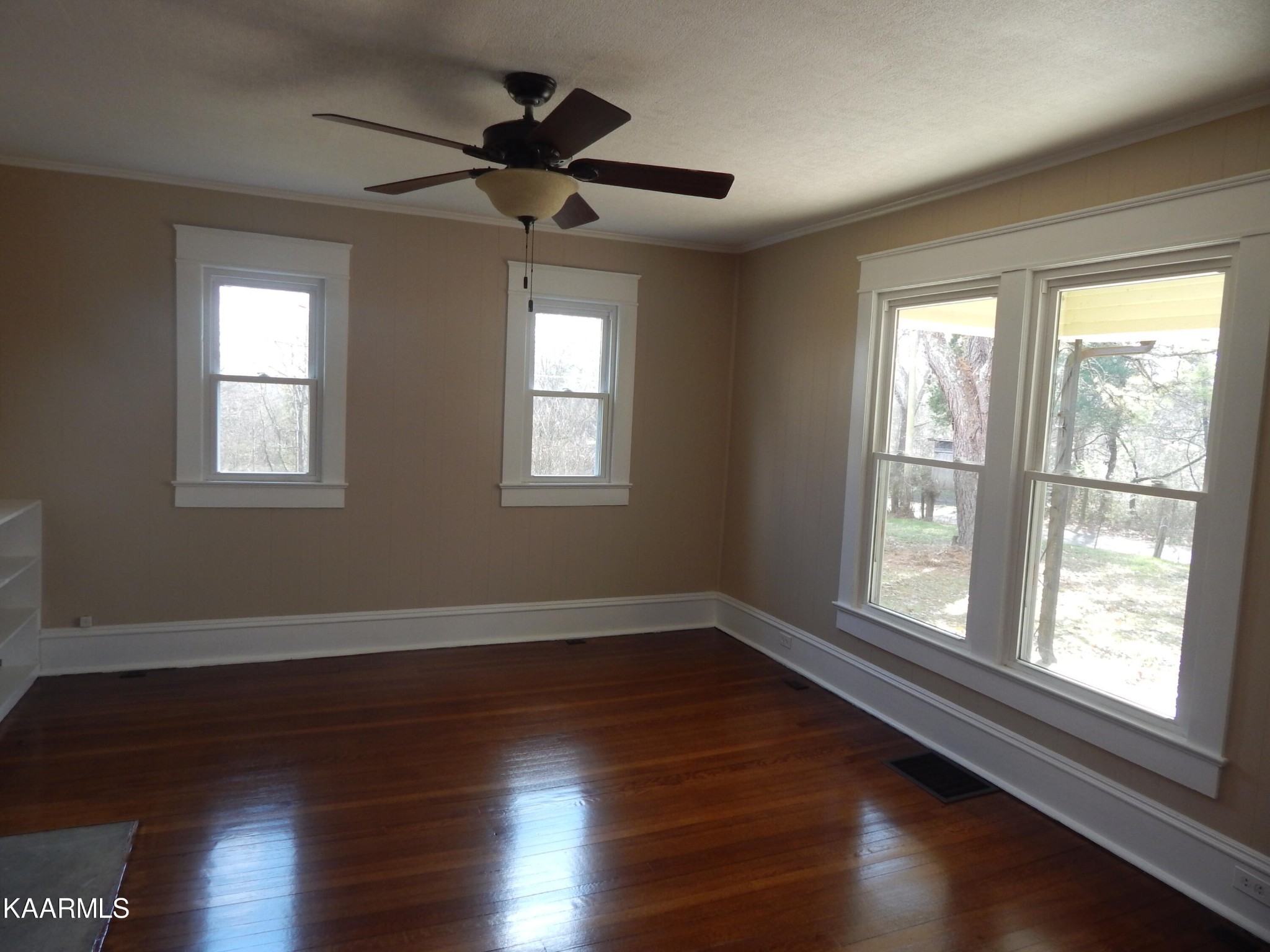 367 Reed Road Greeneville, TN 37745 - Photo 19 of 51 a view of an empty room with wooden floor and a window