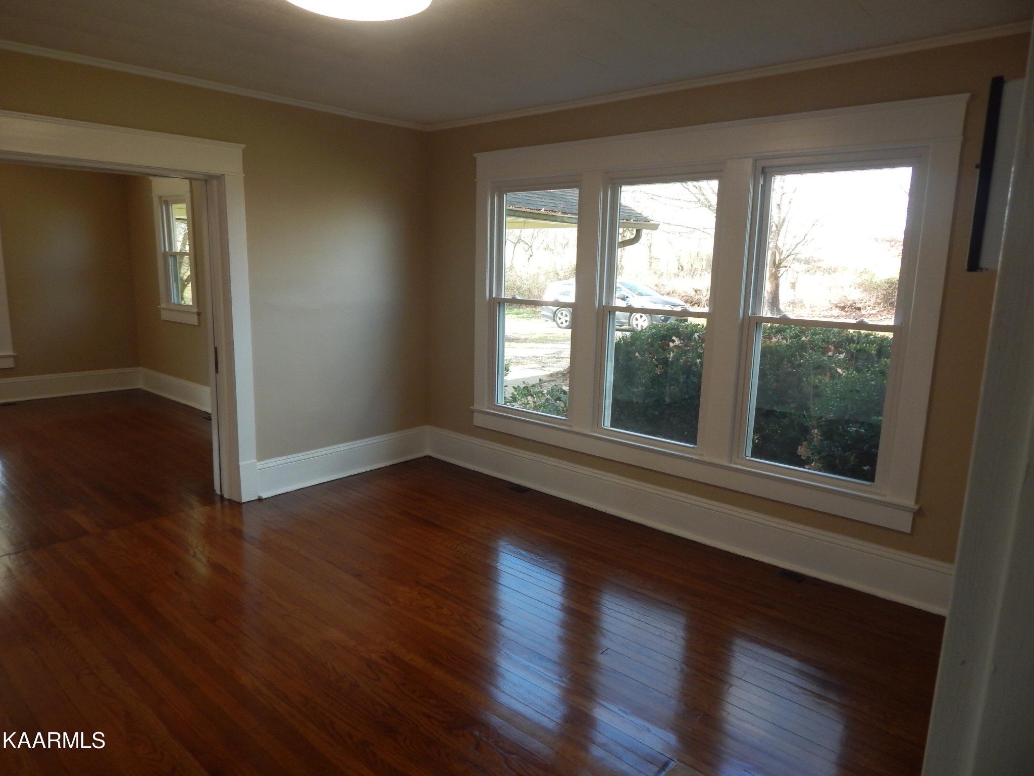 367 Reed Road Greeneville, TN 37745 - Photo 20 of 51 a view of an empty room with wooden floor and a window